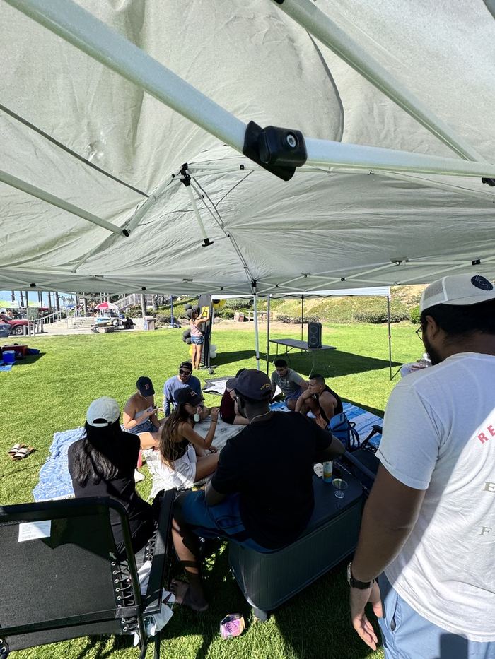 Guests hanging out in the shade under the canopy
