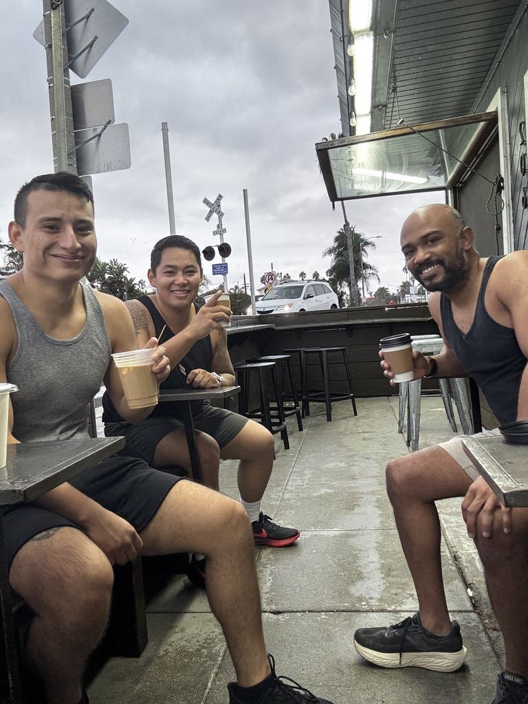Josh and two run club dads with coffee after the run
